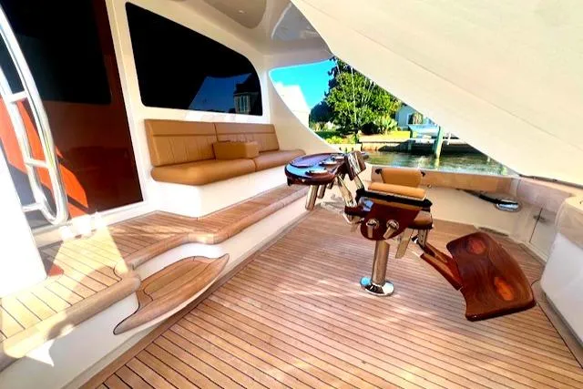  Yacht Photos Pics Luxurious 2024 Custom Carolina Albemarle Spencer yacht interior with teak flooring and seating.