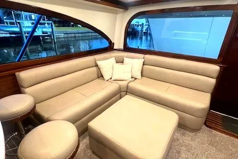  Yacht Photos Pics Luxurious 2024 Custom Carolina Albemarle Spencer yacht interior with beige leather seating.
