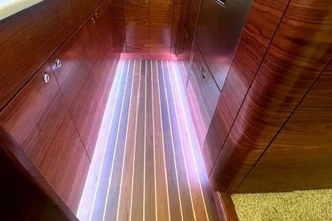  Yacht Photos Pics Luxurious 2024 Custom Carolina Albemarle Spencer yacht interior with elegant wood finish and LED lighting.