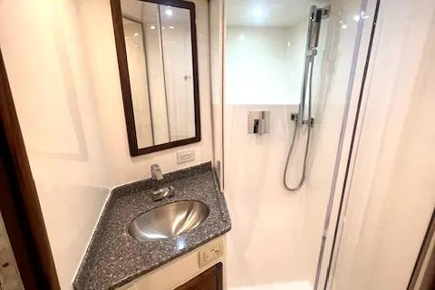  Yacht Photos Pics 2024 Custom Carolina Albemarle Spencer yacht bathroom with modern sink and shower.