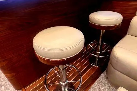  Yacht Photos Pics Luxury seating on 2024 Custom Carolina Albemarle Spencer yacht with wooden flooring.