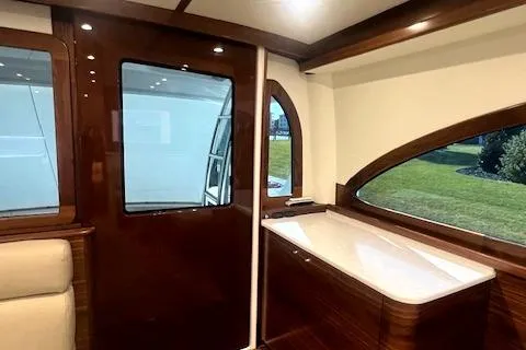  Yacht Photos Pics Luxurious interior of 2024 Custom Carolina Albemarle Spencer yacht with elegant wood finishes.