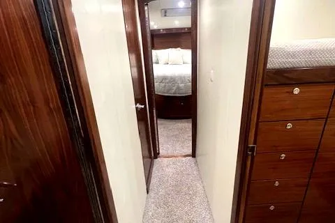  Yacht Photos Pics Interior hallway of 2024 Custom Carolina Albemarle Spencer yacht with wood finishes.