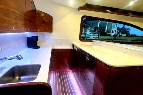  Yacht Photos Pics Luxurious 2024 Custom Carolina Albemarle Spencer yacht interior with modern kitchen design.
