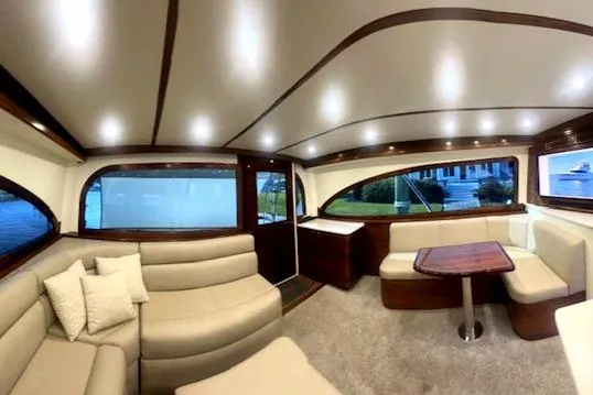 Yacht Photos Pics Luxurious 2024 Custom Carolina Albemarle Spencer yacht interior with elegant seating and modern design.