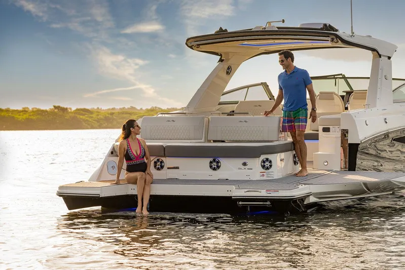  Yacht Photos Pics Manufacturer Provided Image: 2023 Sea Ray SLX 400 luxury boat with people enjoying the water.