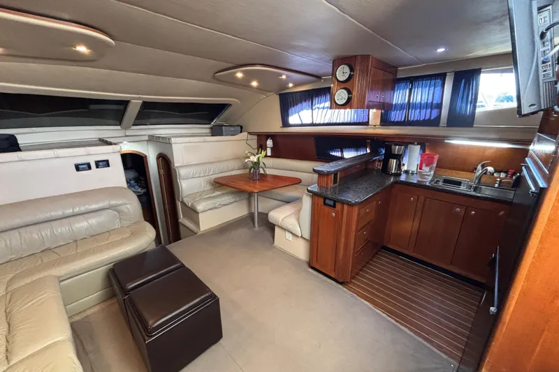 Liberty Call Yacht Photos Pics Luxurious interior of 2005 Cruisers Yachts 455 Express Motoryacht with leather seating and kitchenette.