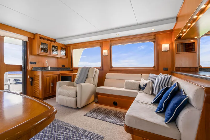  Yacht Photos Pics Luxurious interior of 2007 Fleming 65 yacht with plush seating and elegant wood finishes.