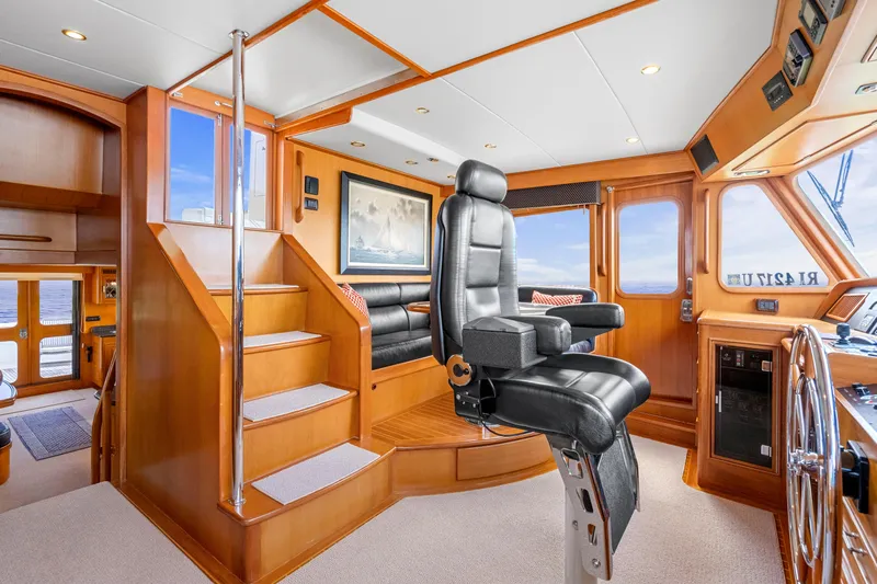  Yacht Photos Pics Luxurious 2007 Fleming 65 yacht interior with captain's chair and wooden finishes.