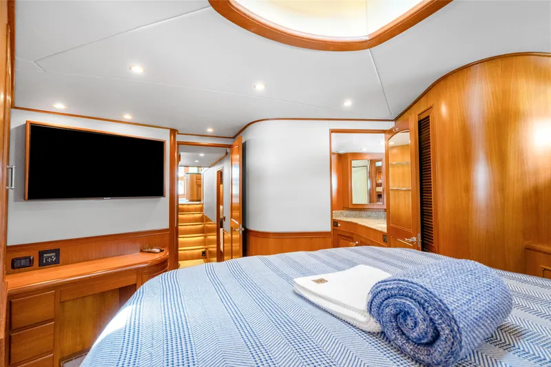 Yacht Photos Pics Luxurious cabin interior of 2007 Fleming 65 yacht with modern amenities and elegant wood finishes.