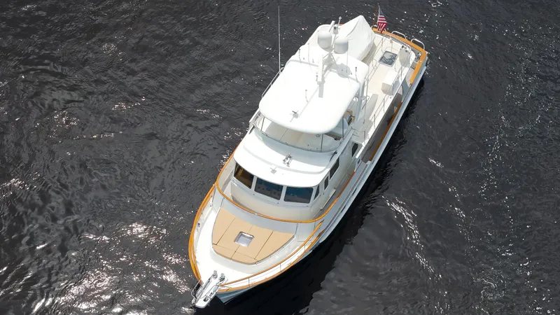  Yacht Photos Pics Aerial view of a 2007 Fleming 65 yacht cruising on dark water.