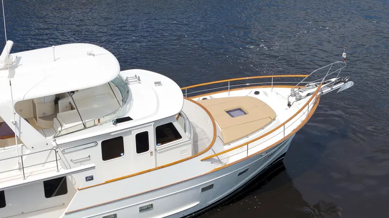  Yacht Photos Pics Luxury 2007 Fleming 65 yacht on calm water, showcasing elegant design and spacious deck.