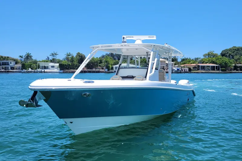  Yacht Photos Pics 2018 Everglades 355 Center Console boat on clear blue water, sunny day.