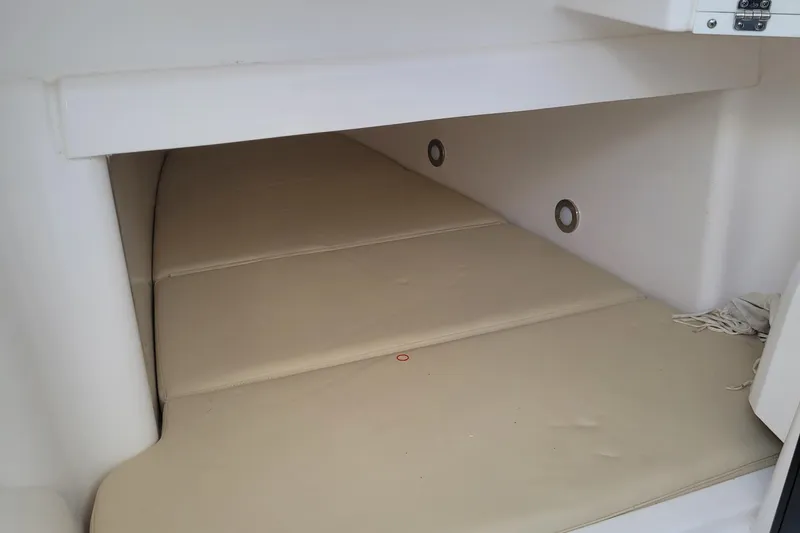  Yacht Photos Pics 2018 Everglades 355 Center Console cabin interior with beige cushions.