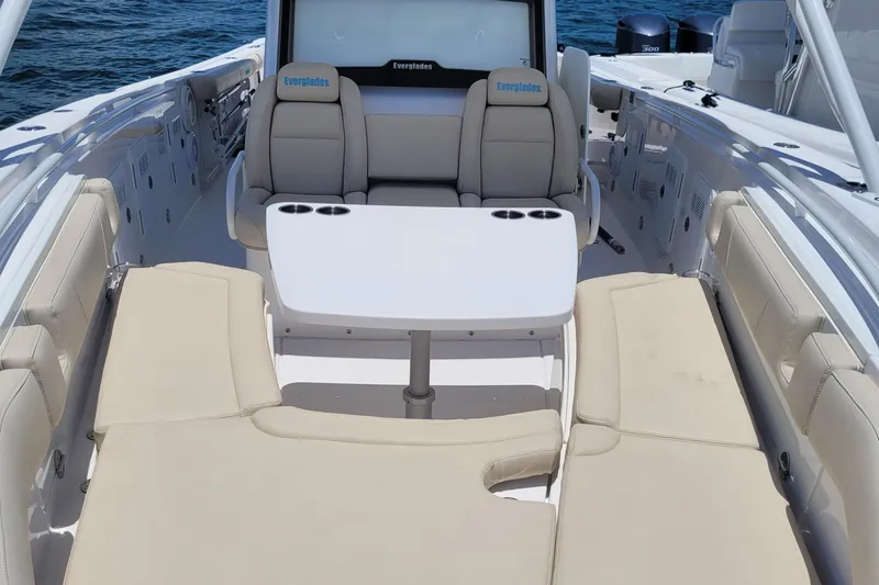  Yacht Photos Pics 2018 Everglades 355 Center Console boat interior with seating and table on open water.