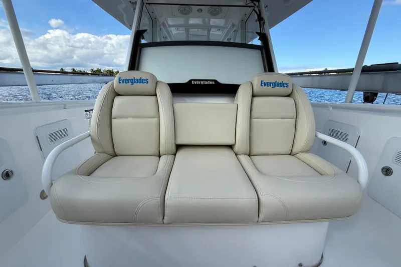  Yacht Photos Pics 2018 Everglades 355 Center Console boat with beige seating, ocean view background.