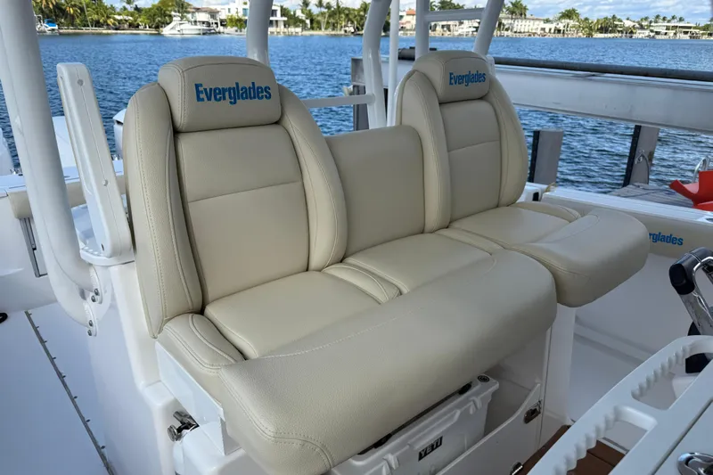  Yacht Photos Pics 2018 Everglades 355 Center Console boat seats with beige upholstery, dockside view.