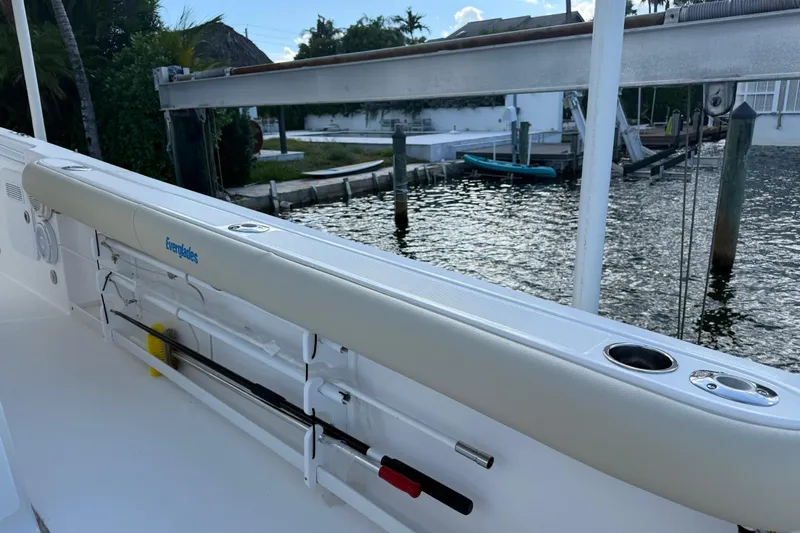  Yacht Photos Pics 2018 Everglades 355 Center Console boat docked by waterfront with fishing rod holders.