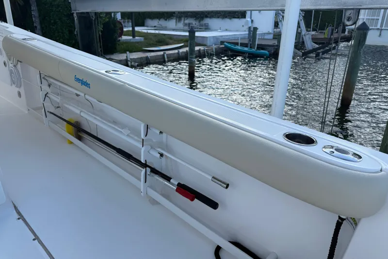  Yacht Photos Pics 2018 Everglades 355 Center Console boat with rod holders and cup holders by the water.