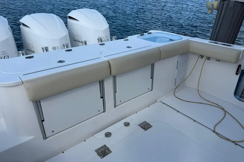  Yacht Photos Pics 2018 Everglades 355 Center Console boat with Yamaha engines, featuring cushioned seating and storage.