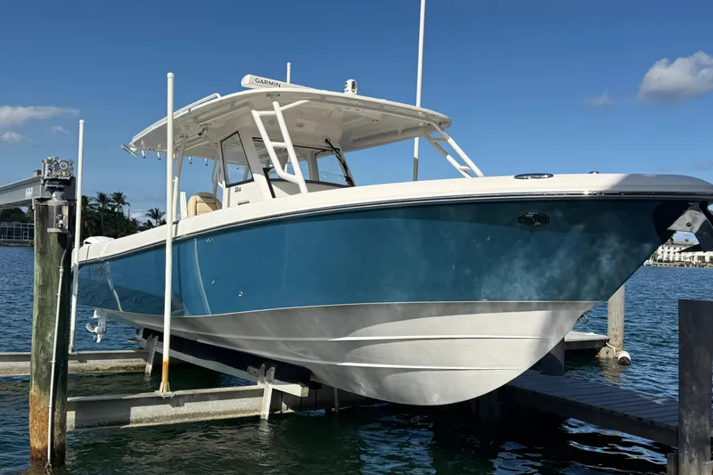  Yacht Photos Pics 2018 Everglades 355 Center Console boat docked on a sunny day.