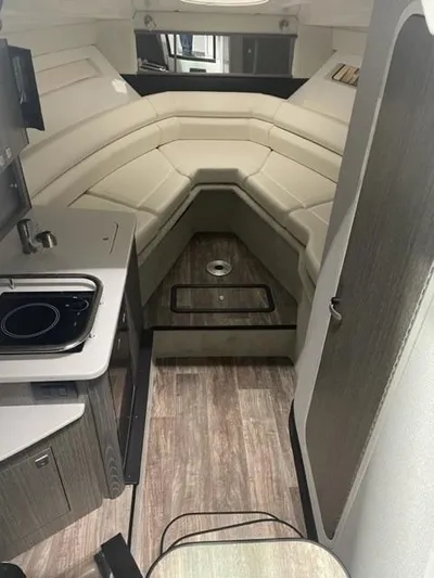  Yacht Photos Pics Interior of 2022 Monterey 295 Sport Yacht with modern kitchen and seating area.