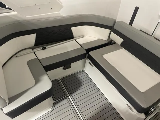  Yacht Photos Pics 2022 Monterey 295 Sport Yacht interior seating with modern gray and white upholstery.