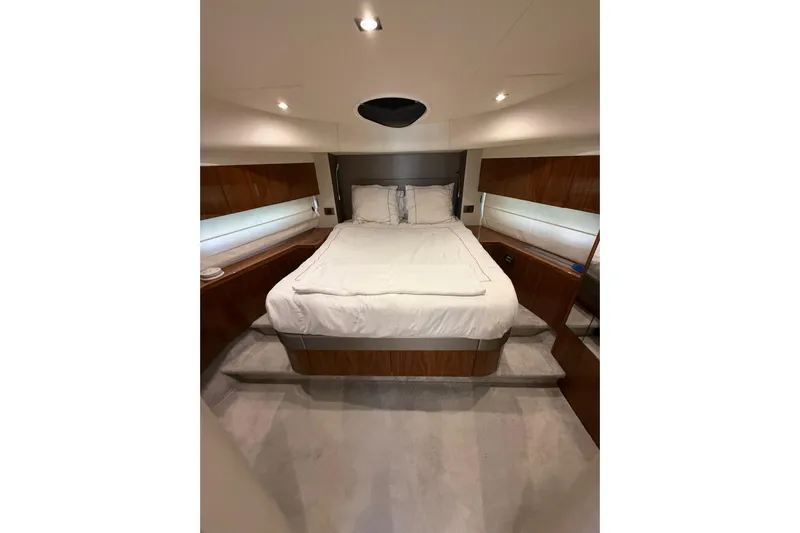 Lady A Yacht Photos Pics Luxurious bedroom interior of 2017 Sunseeker Manhattan 65 yacht with elegant wood finishes.