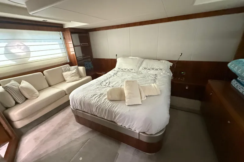 Lady A Yacht Photos Pics Luxurious bedroom interior of 2017 Sunseeker Manhattan 65 yacht with cozy bed and sofa.