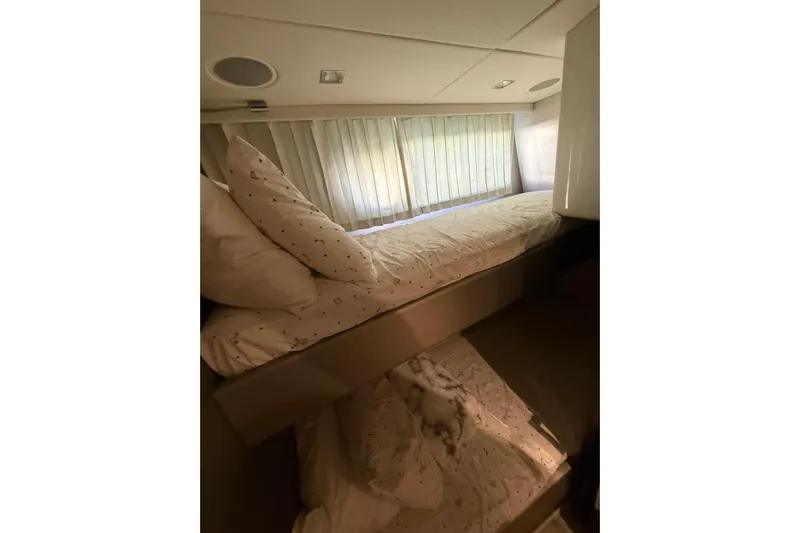 Lady A Yacht Photos Pics Interior of 2017 Sunseeker Manhattan 65 yacht with cozy bunk beds and soft lighting.