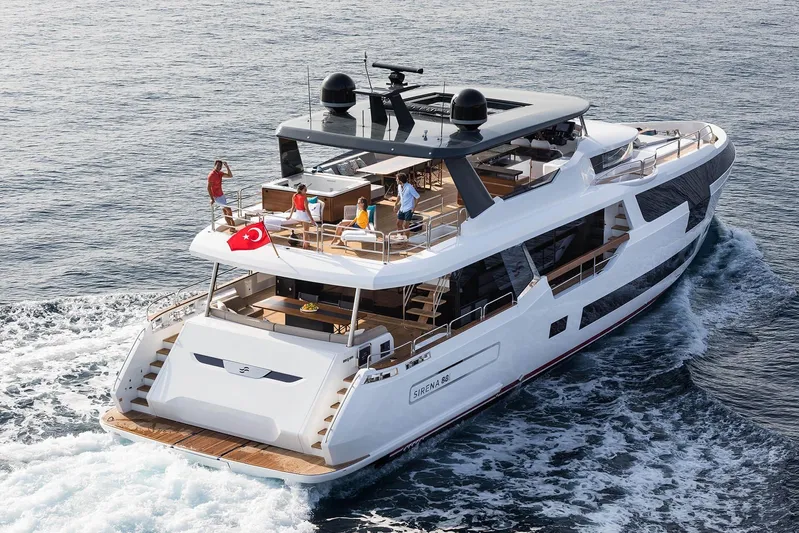  Yacht Photos Pics Luxurious 2023 Sirena 88 yacht cruising with passengers on deck, featuring modern design and Turkish flag.