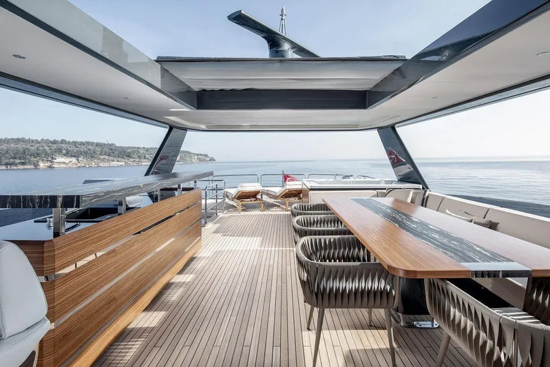  Yacht Photos Pics Luxurious 2023 Sirena 88 yacht deck with elegant seating and ocean view.