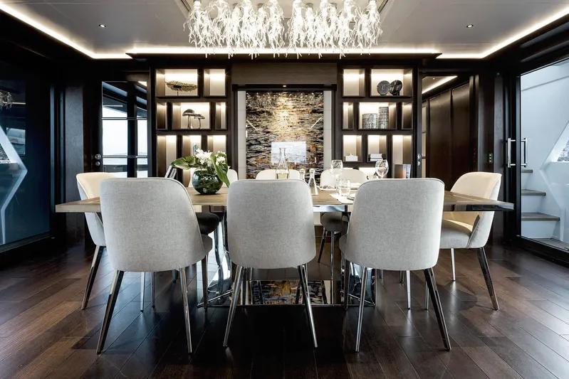  Yacht Photos Pics Luxurious dining area on 2023 Sirena 88 yacht with elegant decor and modern lighting.