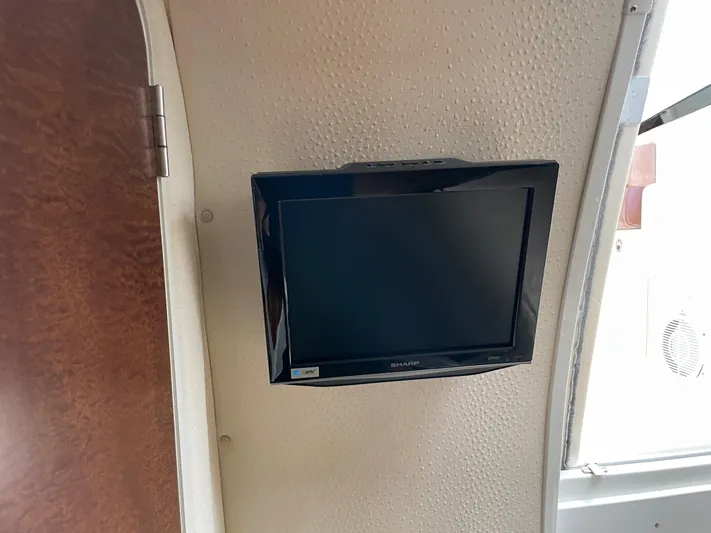  Yacht Photos Pics Wall-mounted TV inside 2008 Hydra-Sports 3500VX boat cabin.