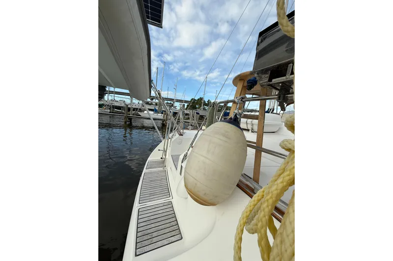 Fine Romance Yacht Photos Pics 1997 Beneteau Oceanis 40 CC sailboat docked, featuring deck view and fender.