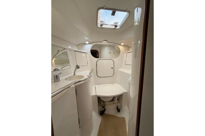 Fine Romance Yacht Photos Pics Interior of 1997 Beneteau Oceanis 40 CC yacht bathroom with sink and toilet.