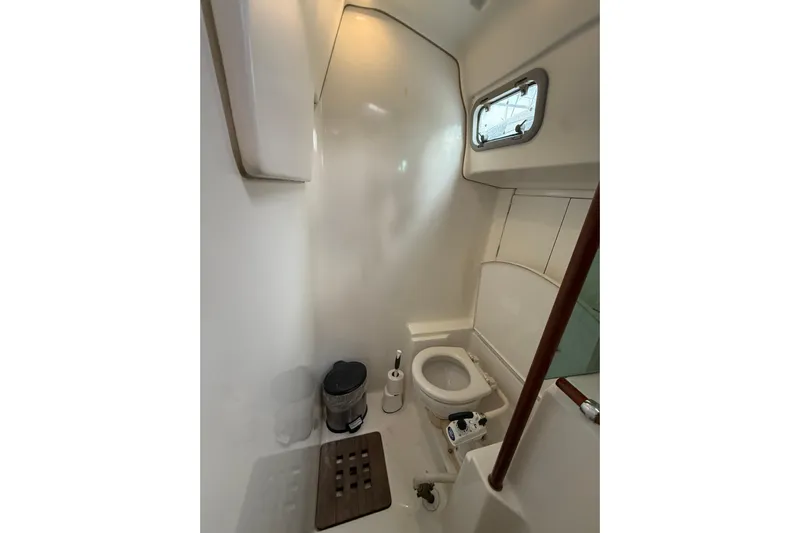 Fine Romance Yacht Photos Pics Bathroom interior of 1997 Beneteau Oceanis 40 CC sailboat, featuring compact design.