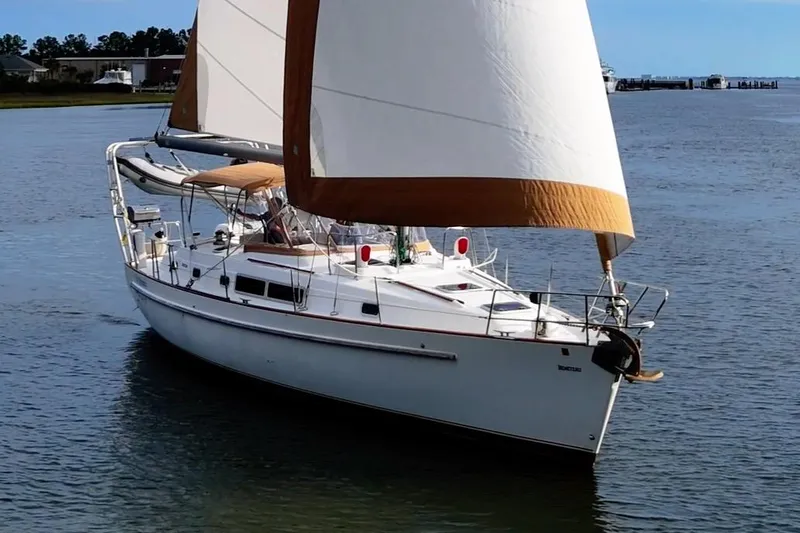 Fine Romance Yacht Photos Pics 1997 Beneteau Oceanis 40 CC sailboat cruising on calm waters.