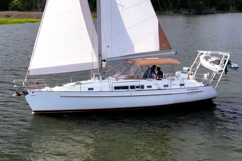 Fine Romance Yacht Photos Pics 1997 Beneteau Oceanis 40 CC sailboat cruising on calm waters.