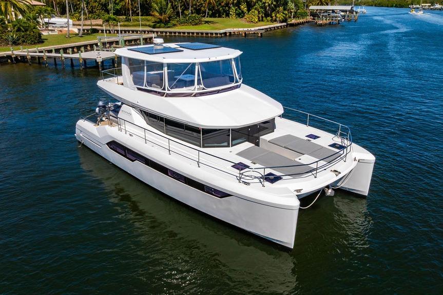 2022 Leopard 53 Powercat yacht cruising on a serene waterway.