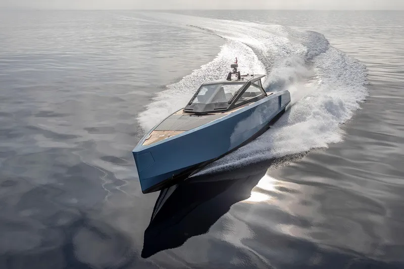  Yacht Photos Pics Sleek 2022 Wally WALLYPOWER58 yacht cruising on calm waters.