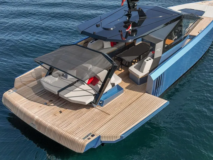  Yacht Photos Pics 2022 Wally WALLYPOWER58 luxury yacht with sleek design and spacious deck on calm water.