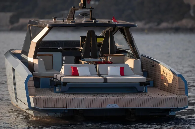  Yacht Photos Pics Luxury 2022 Wally WALLYPOWER58 yacht with elegant deck and seating, cruising on calm waters.
