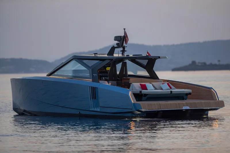  Yacht Photos Pics Luxury 2022 Wally WALLYPOWER58 yacht on calm water at sunset.