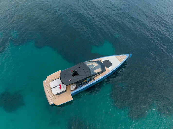  Yacht Photos Pics Aerial view of 2022 Wally WALLYPOWER58 yacht on clear blue water.