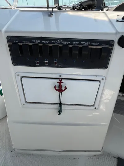  Yacht Photos Pics Control panel of a 1996 Bayliner 3788 Command Bridge Motoryacht with switches and anchor decoration.