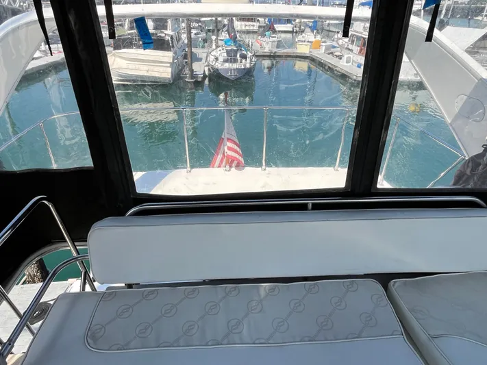  Yacht Photos Pics View from 1996 Bayliner 3788 Command Bridge Motoryacht, overlooking marina with American flag.