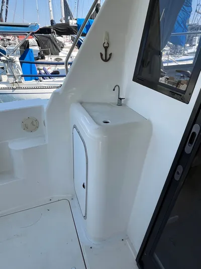  Yacht Photos Pics 1996 Bayliner 3788 Command Bridge Motoryacht deck with sink and nautical decor.