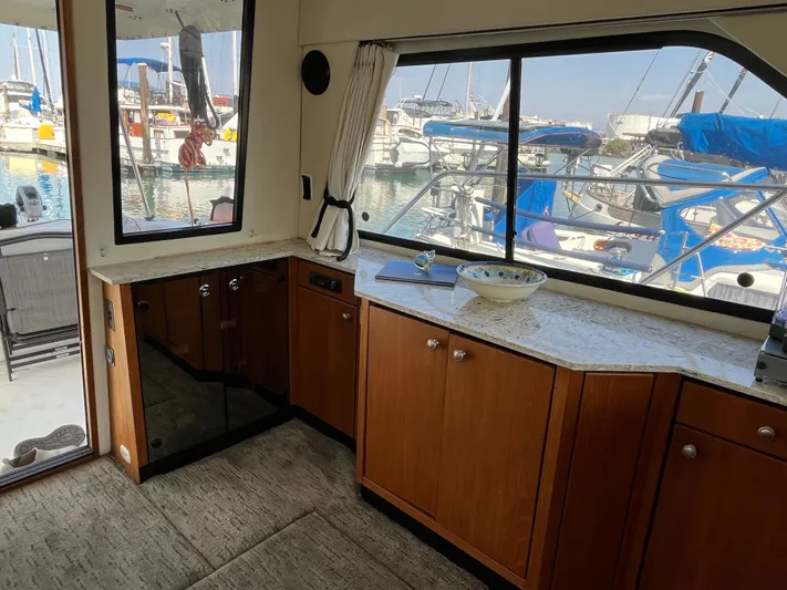  Yacht Photos Pics Interior of 1996 Bayliner 3788 Command Bridge Motoryacht with marina view.