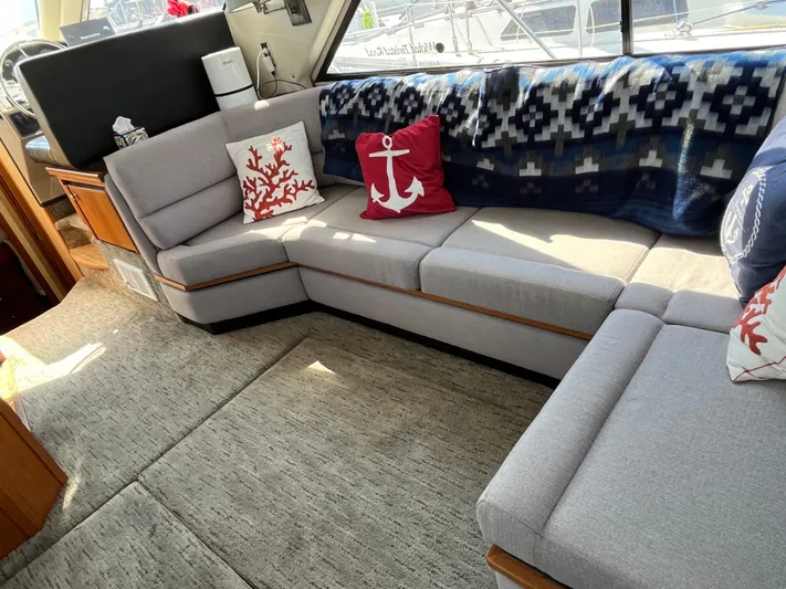  Yacht Photos Pics Interior of 1996 Bayliner 3788 yacht with cozy seating and nautical-themed decor.